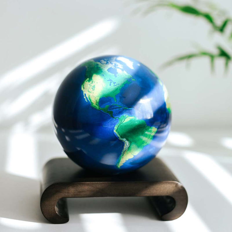 4.5 inch Earth Mova Globe displayed on wooden stand