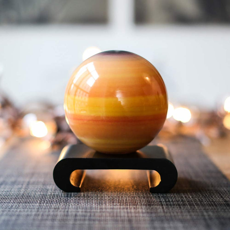 Mova Globe 4.5 inch Saturn displayed on a black wood stand